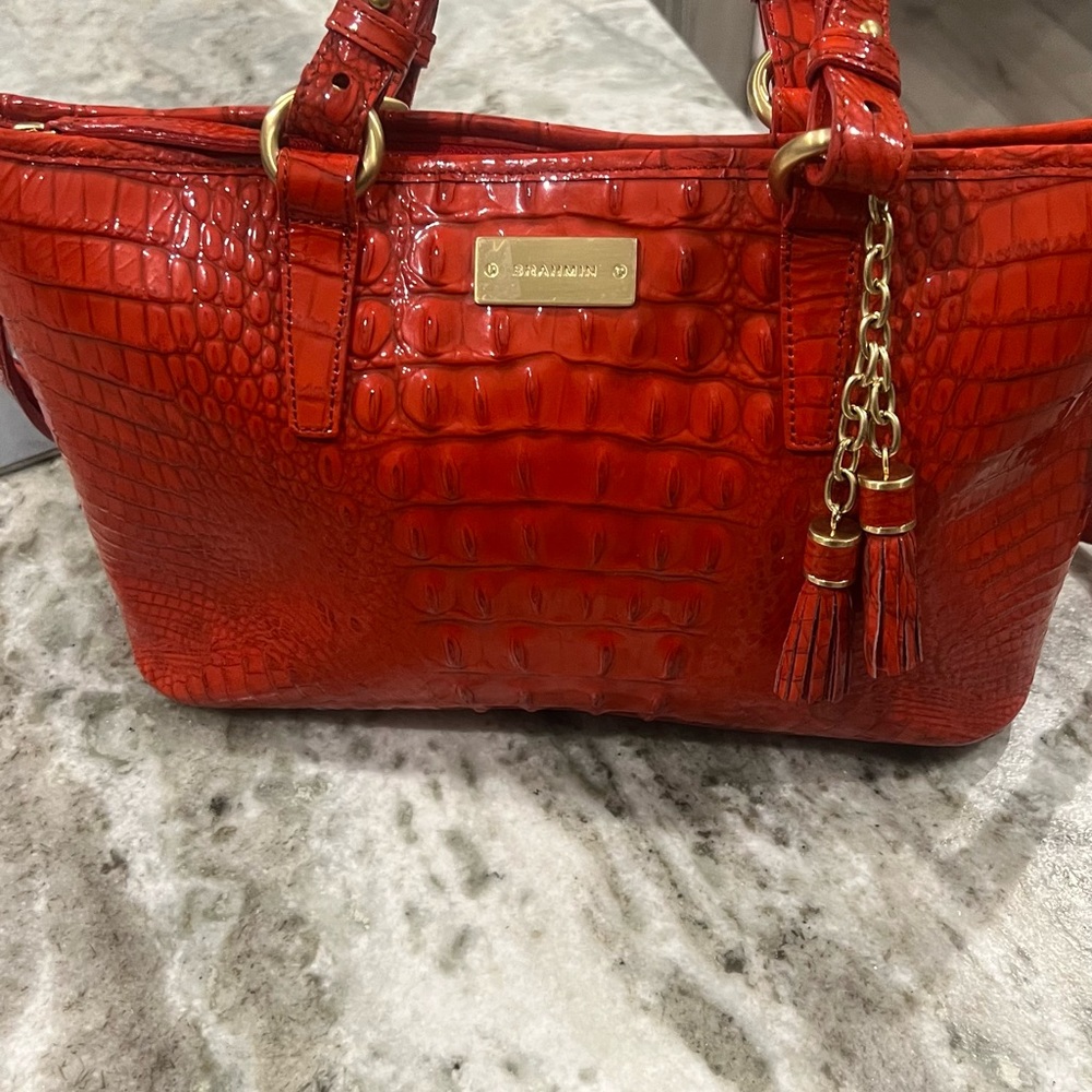 Brahmin red handbag with shoulder straps and hand held straps